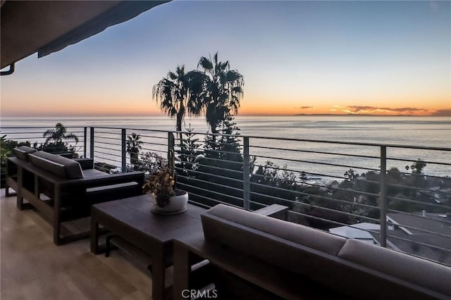 balcony at dusk with a water view