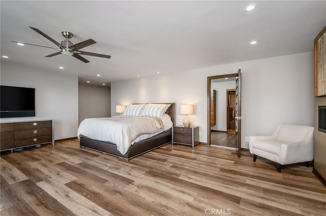 bedroom featuring ceiling fan and hardwood / wood-style floors