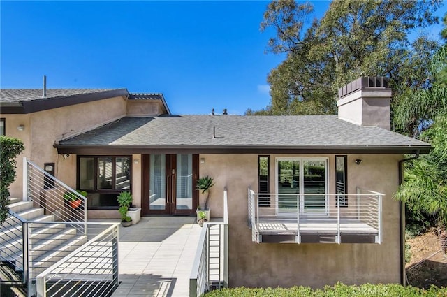 back of property with french doors