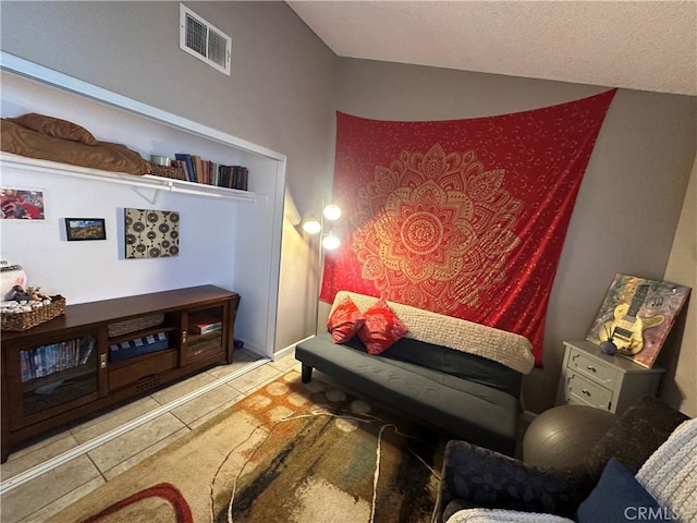 sitting room featuring tile patterned flooring