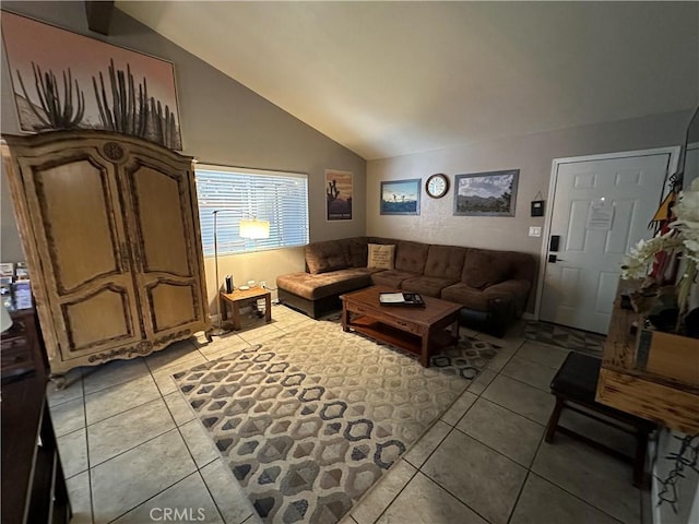 living room featuring lofted ceiling and light tile patterned floors