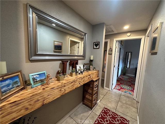 hallway featuring light tile patterned flooring