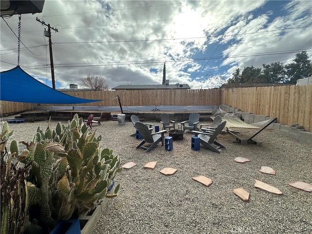 view of yard with a fire pit