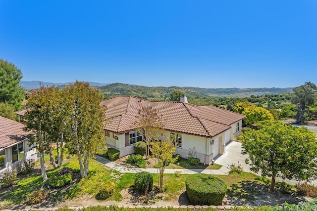 birds eye view of property featuring a mountain view