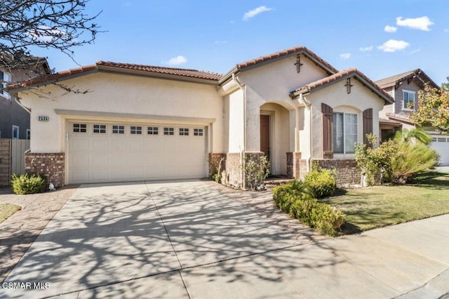 mediterranean / spanish home featuring a garage