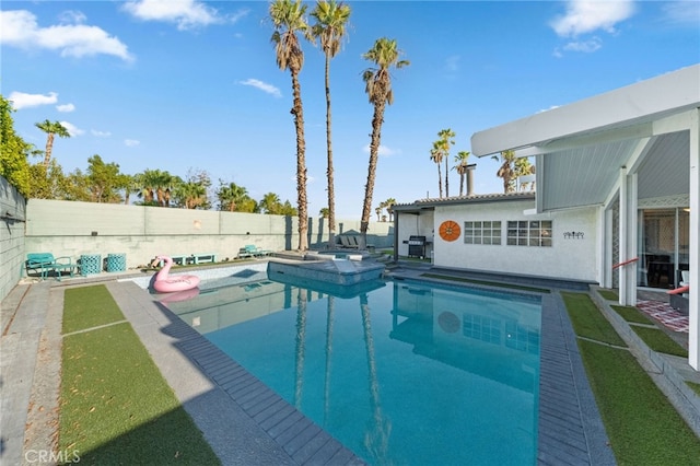 view of swimming pool featuring a patio area