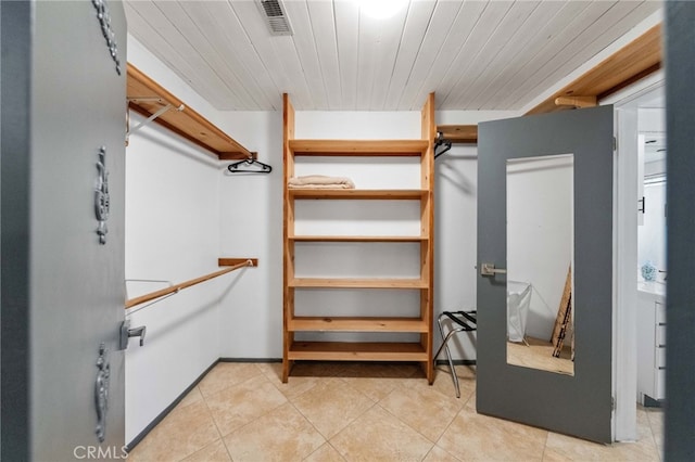 walk in closet featuring light tile patterned floors