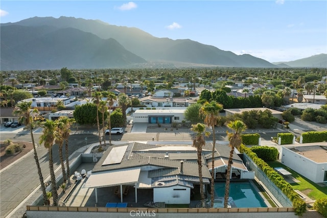 birds eye view of property featuring a mountain view