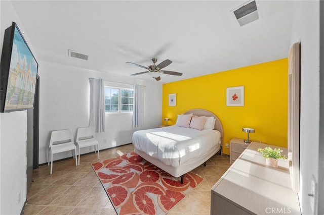 bedroom with ceiling fan and light tile patterned flooring