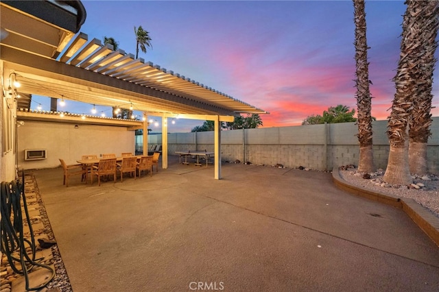 view of patio terrace at dusk