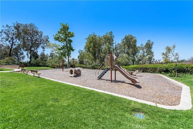 view of playground with a yard