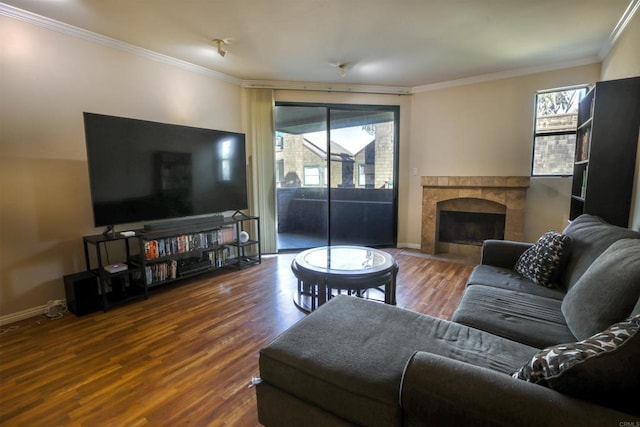 living room featuring dark hardwood / wood-style floors and ornamental molding