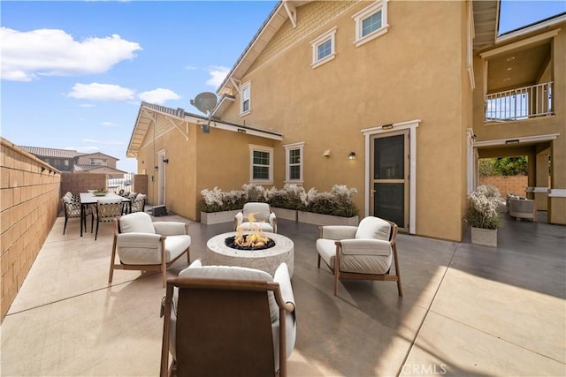 view of patio featuring an outdoor fire pit