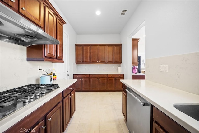 kitchen with light tile patterned floors, appliances with stainless steel finishes, and sink