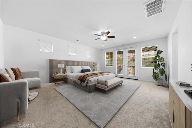 bedroom featuring ceiling fan, access to exterior, light colored carpet, and french doors