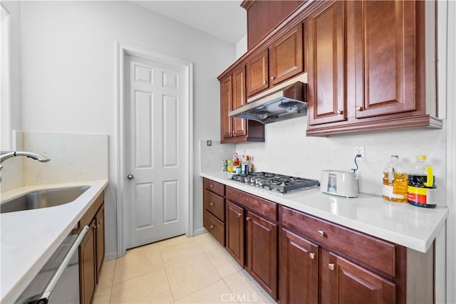 kitchen with light tile patterned floors, sink, and stainless steel appliances