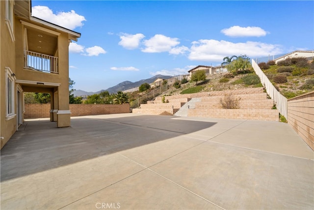 view of patio / terrace with a mountain view