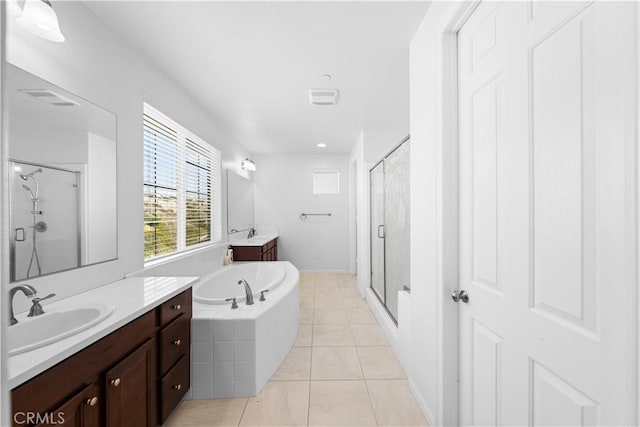 bathroom with independent shower and bath, tile patterned flooring, and vanity