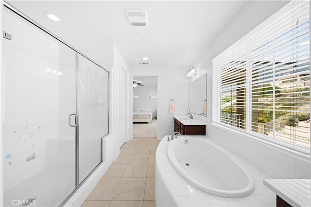 bathroom with ceiling fan, tile patterned flooring, independent shower and bath, and vanity