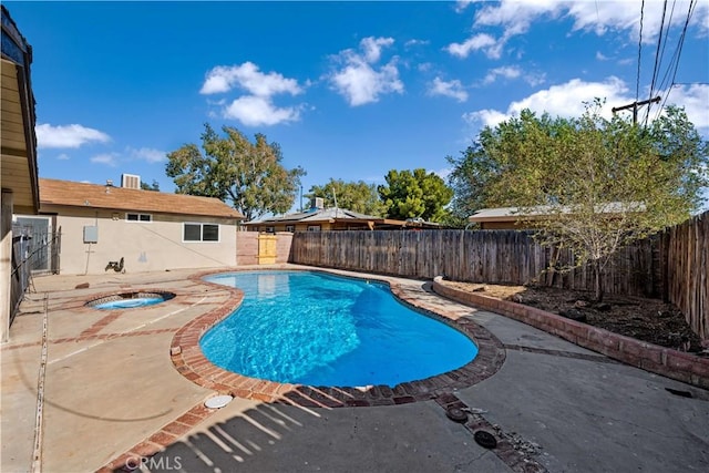 view of pool featuring a patio area and a jacuzzi