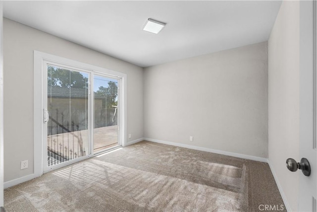 empty room featuring light carpet