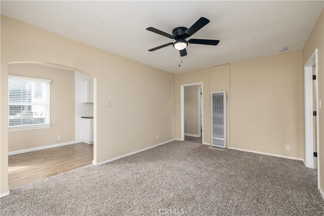 unfurnished bedroom with ceiling fan and carpet