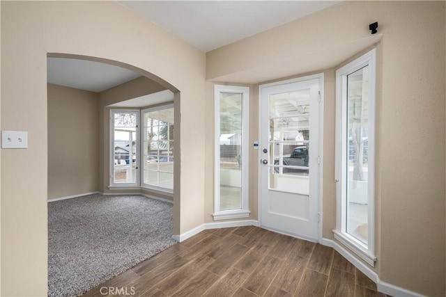 doorway to outside with dark wood-type flooring