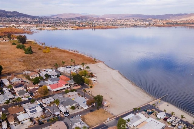 birds eye view of property featuring a water and mountain view