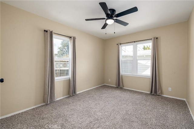 carpeted empty room with ceiling fan