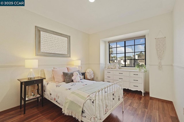 bedroom featuring dark hardwood / wood-style floors