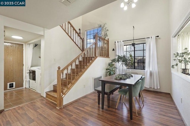 dining space featuring a chandelier and dark hardwood / wood-style floors