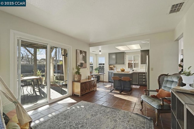 living room featuring dark tile patterned floors