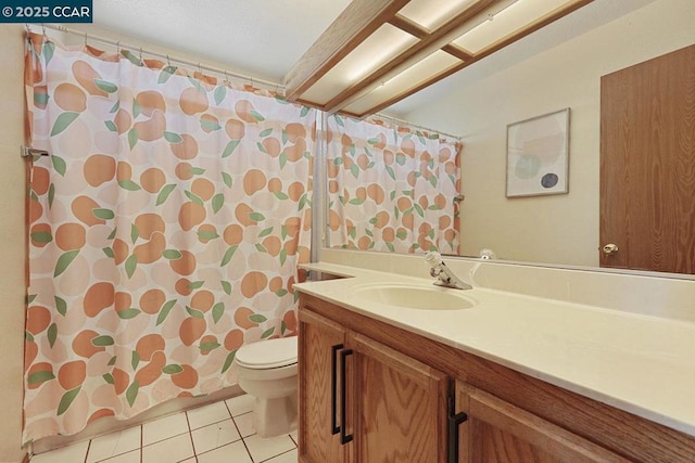 bathroom featuring a shower with curtain, tile patterned floors, vanity, and toilet