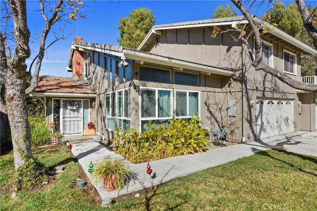 view of front facade with a front lawn and a garage