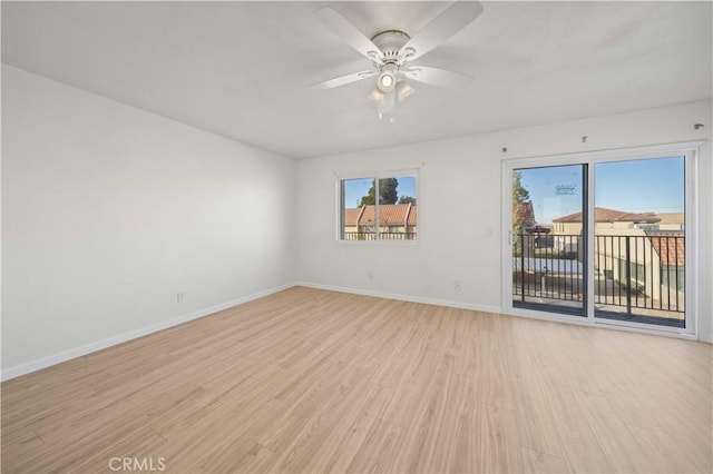 empty room featuring light hardwood / wood-style floors and ceiling fan