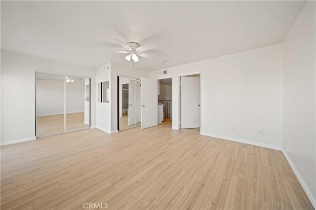 unfurnished bedroom with ceiling fan and light wood-type flooring