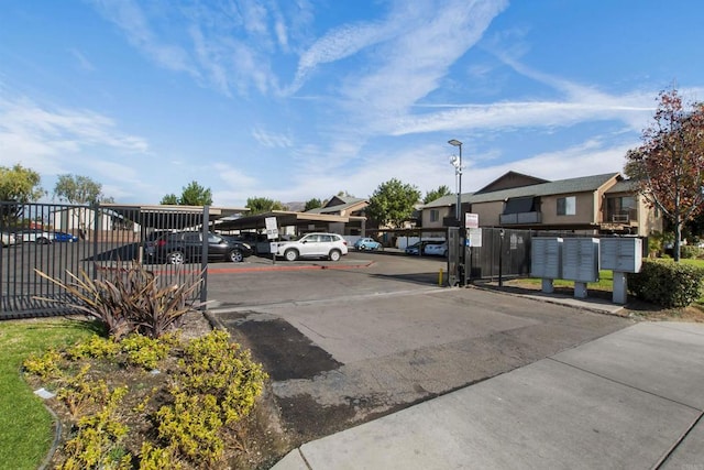 view of parking / parking lot with mail boxes