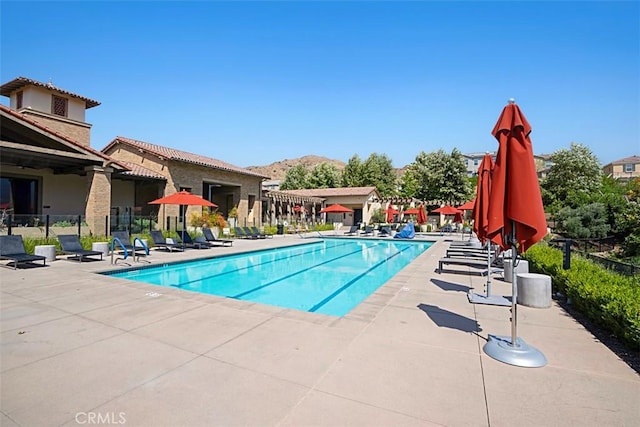 view of swimming pool with a patio area