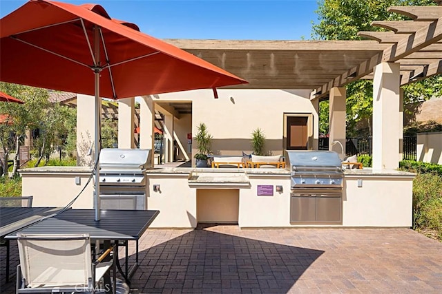 view of patio / terrace featuring area for grilling, a pergola, and grilling area