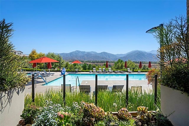 view of pool with a mountain view