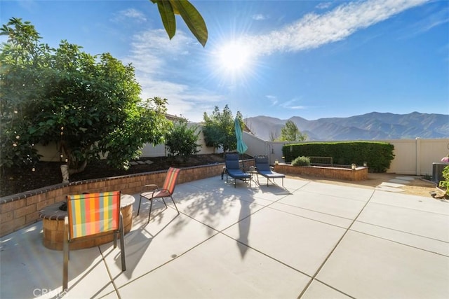 view of patio / terrace with a mountain view