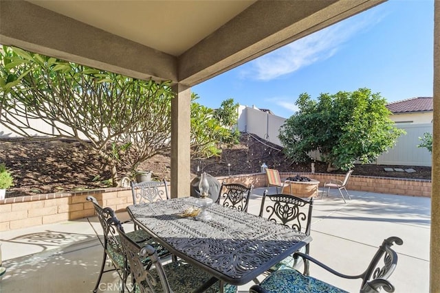 view of patio with a fire pit