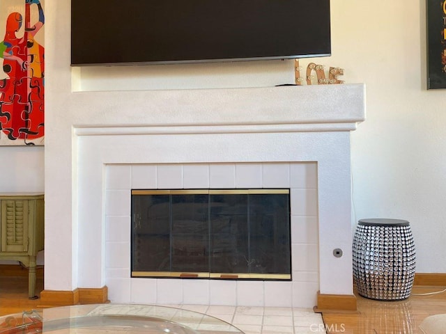 room details featuring a tiled fireplace