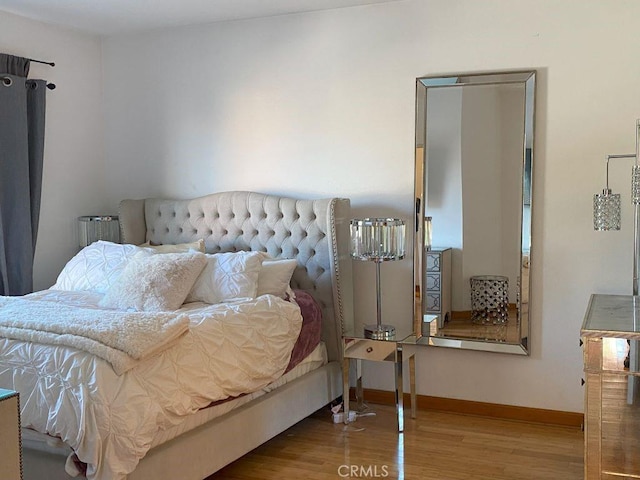 bedroom featuring hardwood / wood-style floors