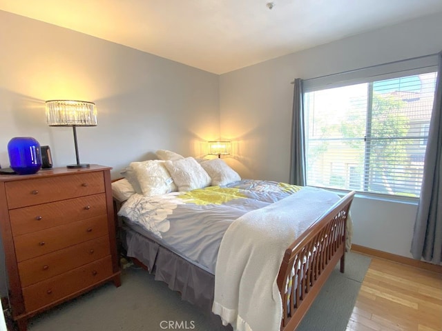 bedroom with light hardwood / wood-style floors