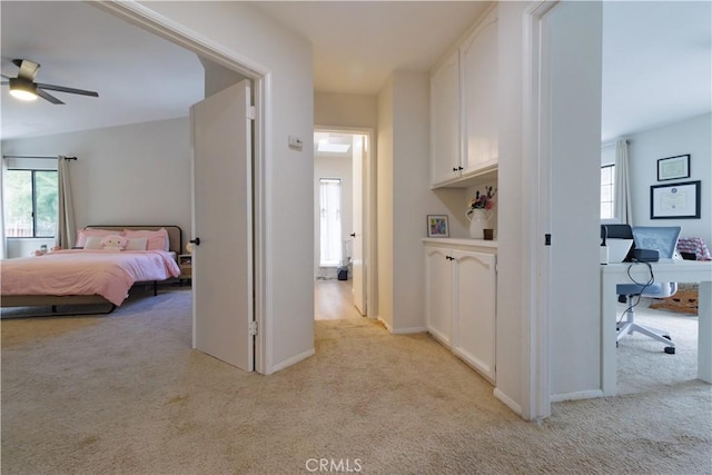 hallway with light colored carpet