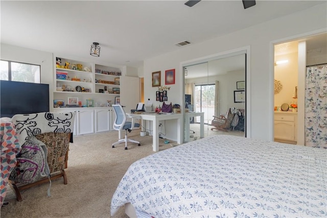 bedroom featuring light carpet and ceiling fan