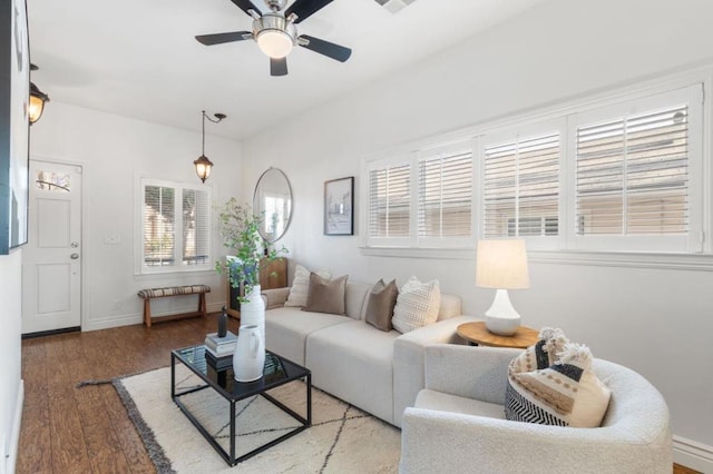 living room with ceiling fan and wood-type flooring