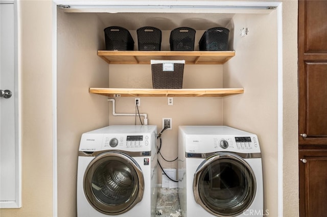 washroom featuring washing machine and clothes dryer