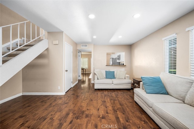 living room with dark hardwood / wood-style floors